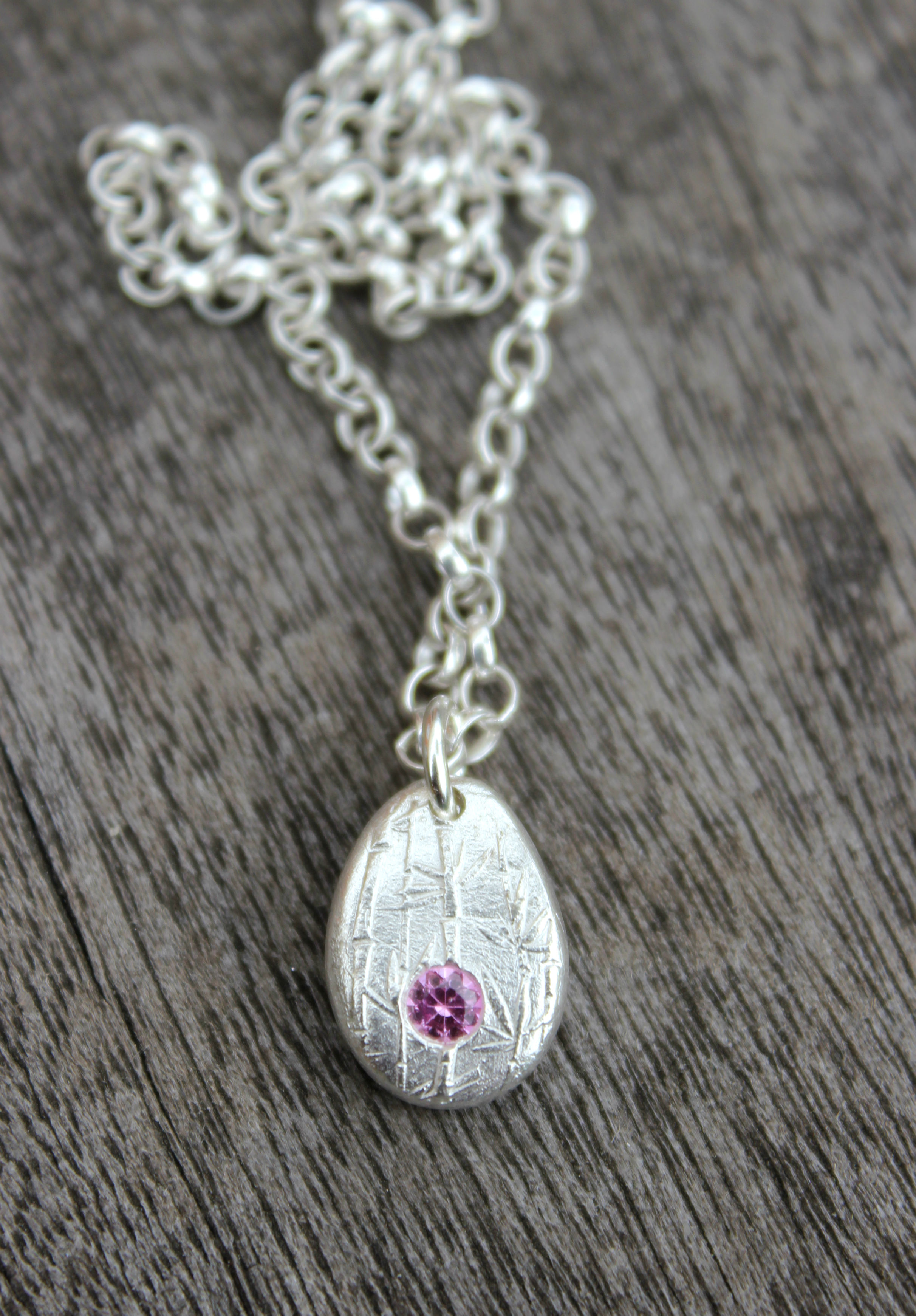Pink sapphire pebble pendant by little silver hedgehog