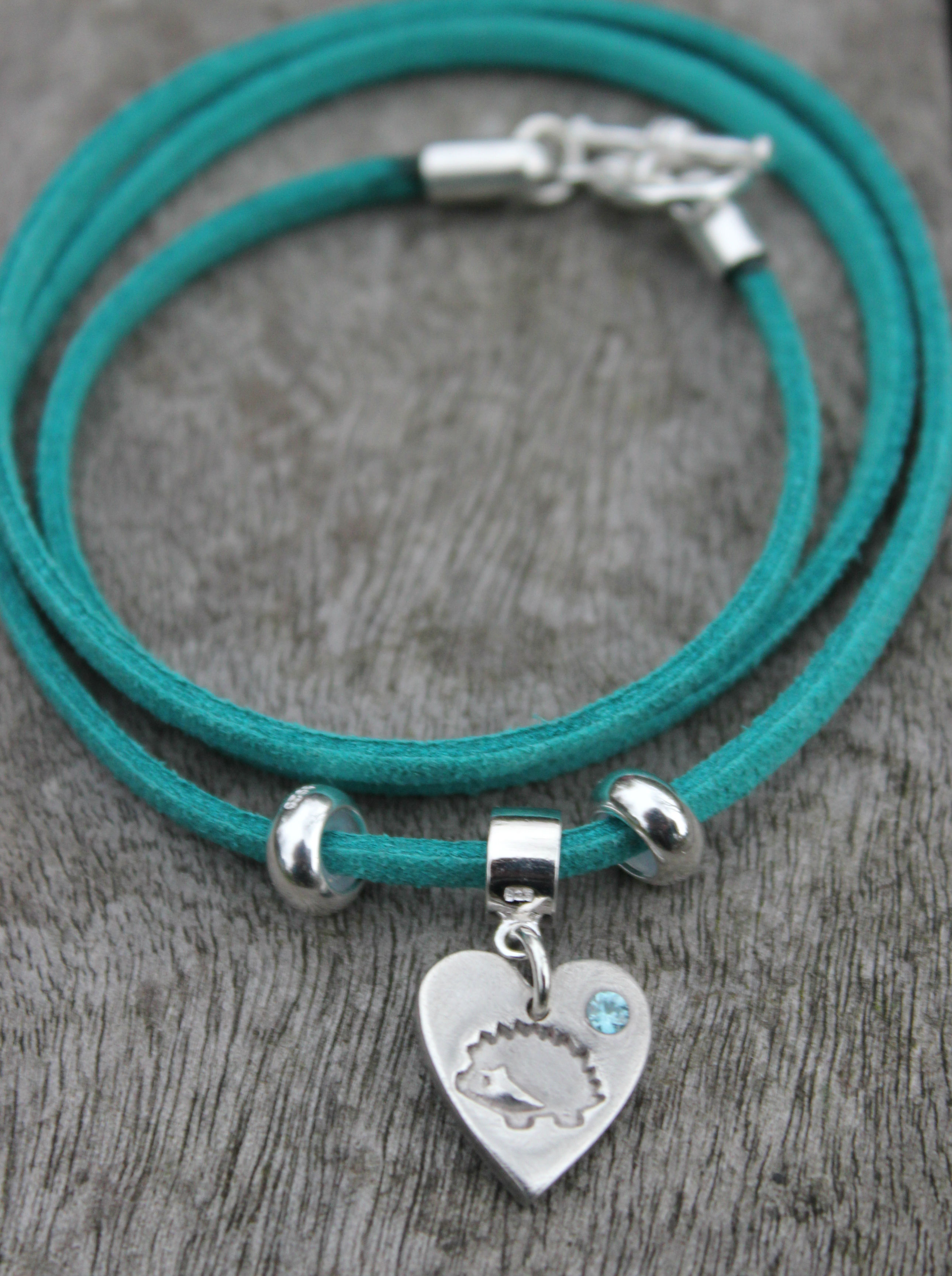teal hedgehog bracelet with hedgehog charm with blue zircon